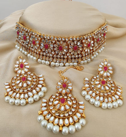Beautiful Golden and Red Color Necklace with Earrings and Matha Tikka designed with Attractive Pearls for Special Occasion