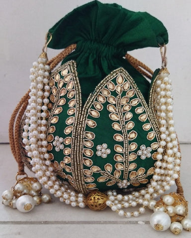 Gorgeous Green Color Kundan Lotus Shaped Potli Strictly made with Hard Base Material for Special Occasion