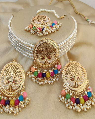 Gorgeous Golden Color Necklace, Earrings and Matha Tikka with Charming Multi Color Pearls for Special Occasion