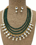 Green Stone and with golden pearls of Earings