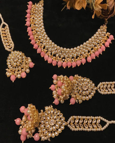 Kaashna Antique Gold Finished Baby Pink Kundan Choker Set.