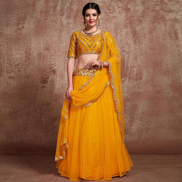 Yellow Colored Partywear Embroidered Soft Net Lehenga Choli