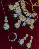 Beautiful Golden Color Kundan with Back Meenakari and Green color Pearls added