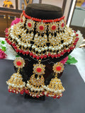 Beautiful Golden and White Color Necklace, Earrings and Maang Tikka along with Beautiful Red Color Beads
