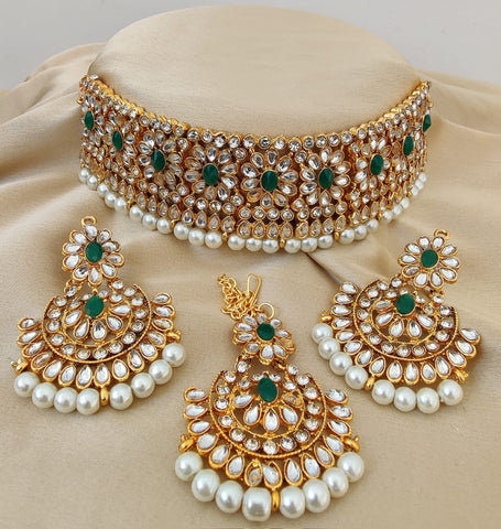 Gorgeous Golden Color Necklace with Earrings and Matha Tikka designed with Attractive Pearls for Special Occasion