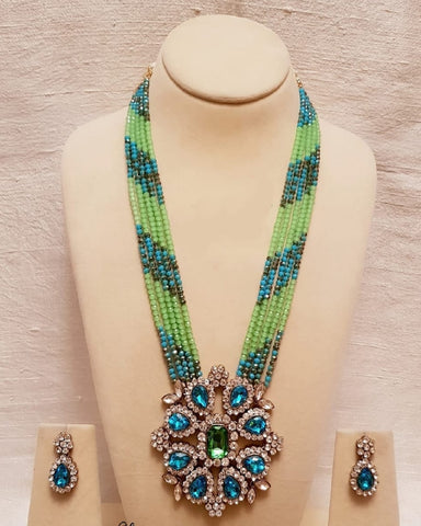 Strings of Sharp Pear Green and Dual Tone Light Blue Golden Pearls and Stylish Kundan Pendant
