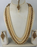 Beautiful Golden Color Necklace, Earrings and Matha Tikka with Charming Golden Color Pearls for Special Occasion