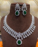 Glossy White Color Necklace and Earrings with Charming Green Color added Pearls for Special Occasion