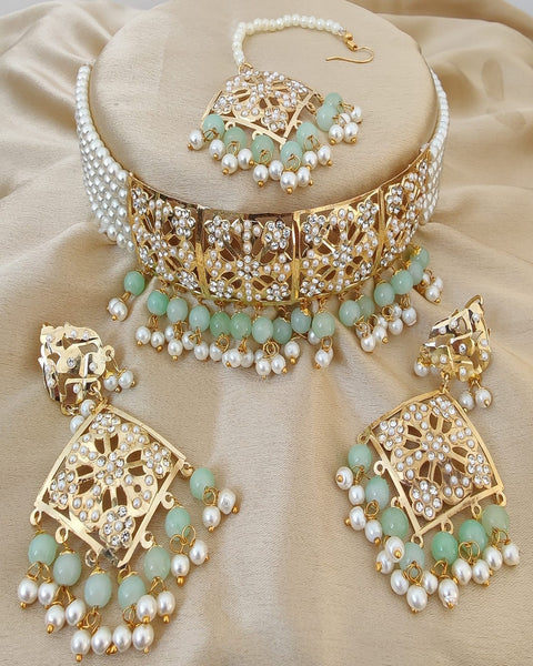 Gorgeous Golden Color Necklace, Earrings and Matha Tikka with Beautiful Light Green Color added Pearls for Special Occasion