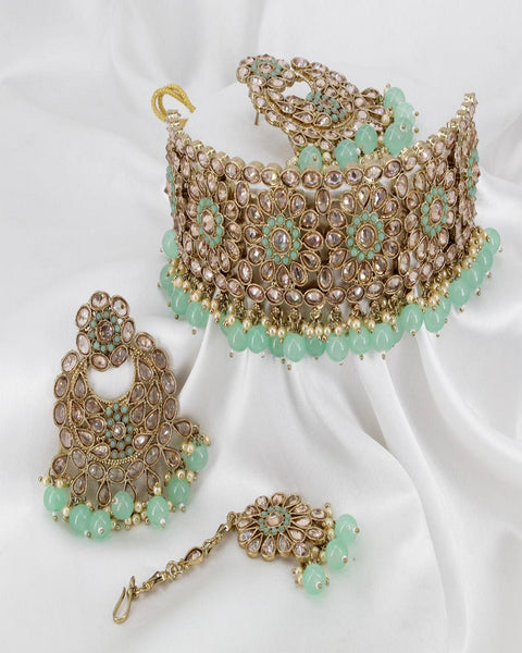 Royal Golden Color High Quality Full AD Stone Choker Necklace, Earrings and Matha Tikka with Beautiful Light Green Color Pearls on both Necklace and Earrings for Special Occasion