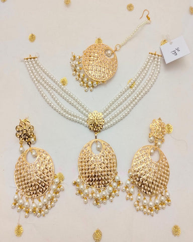 Beautiful Golden Color Necklace, Earrings and Matha Tikka with Charming White Color Pearls for Special Occasion