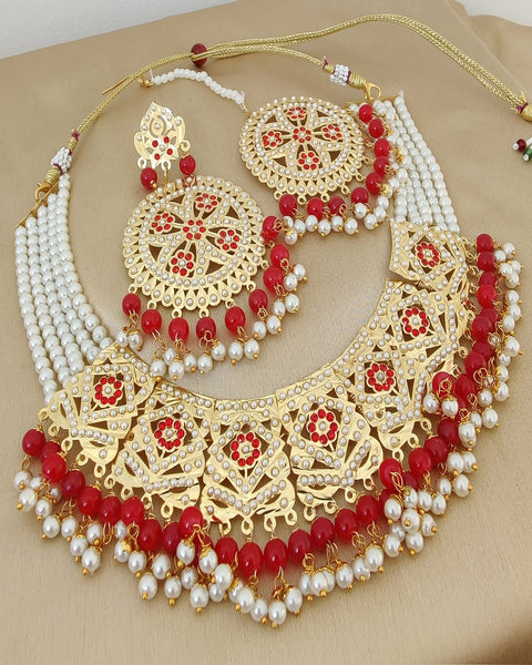 Pretty Golden Color Jadau Choker Necklace with Earrings and Matha Tikka with Charming Red Color Pearls for Special Occasion