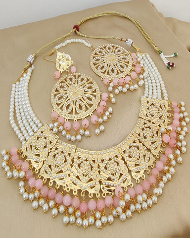 Gorgeous Golden Color Jadau Choker Necklace, Earrings and Matha Tikka with Charming Light Pink Color Pearls for Special Occasion