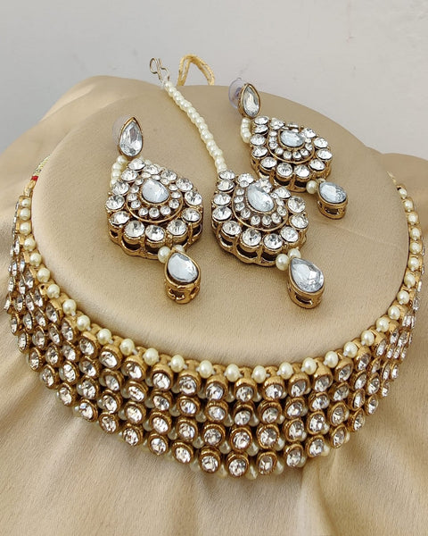 Gorgeous Golden Color Necklace, Earrings and Matha Tikka with Charming White Color Pearls for Special Occasion