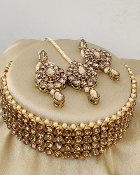 Beautiful Golden Color Necklace with Charming Earrings and Matha Tikka for Special Occasion