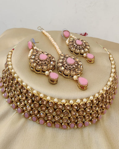 Beautiful Golden Color Necklace, Earrings and Matha Tikka with Charming Pink Color Pearls for Special Occasion