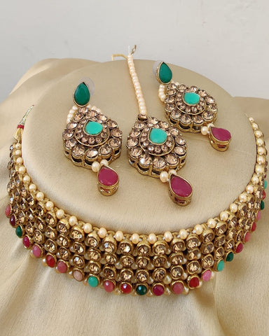 Classy Golden Color Necklace, Earrings and Matha Tikka with Charming Maroon and Green Color Pearls for Special Occasion