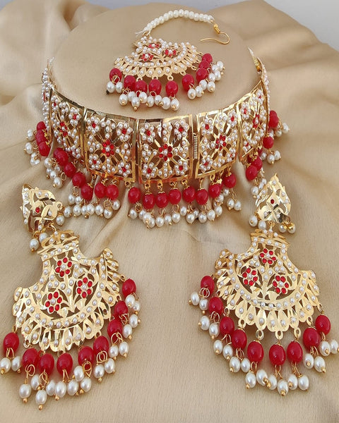 Refined Golden Color Jadau Necklace Set, Earrings and Matha Tikka with Beautiful Red Color Pearls for Special Occasion