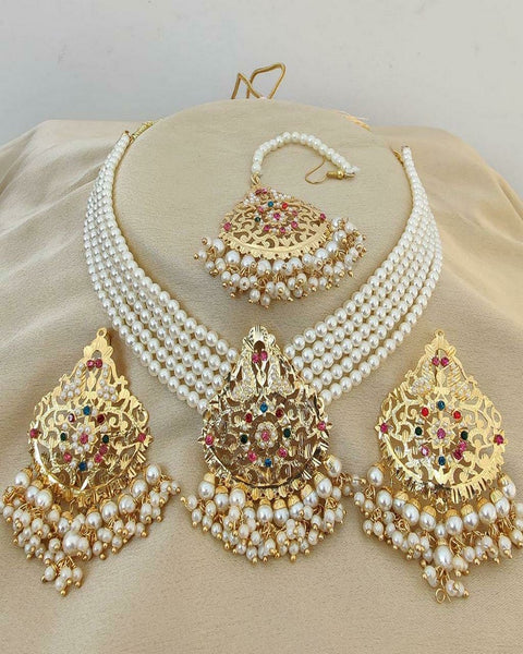 Beautiful Golden Color Necklace, Earrings and Matha Tikka with Charming White Color Pearls for Special Occasion