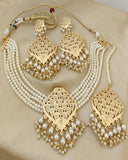 Classy Golden Color Necklace, Earrings and Matha Tikka with Charming White Color Pearls for Special Occasion