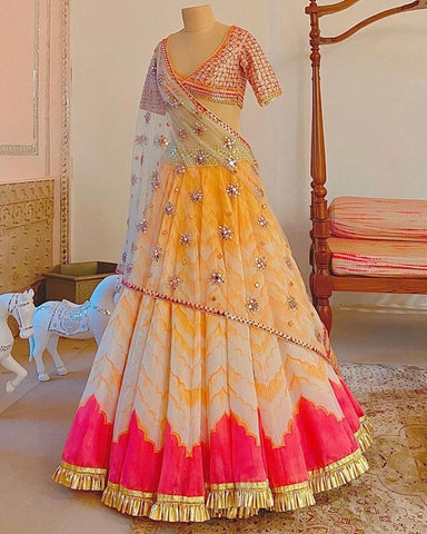 Yellow color designer mirror work lehenga choli