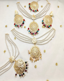 Charming Golden Color Necklace, Earrings and Matha Tikka with beautiful White, Green and Maroon Color Pearls for Special Occasion