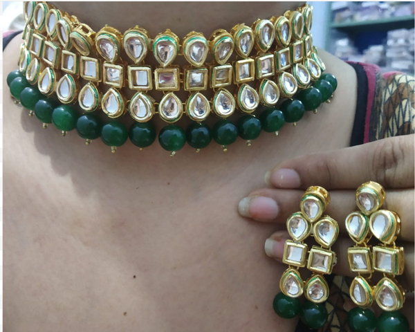 Charming Golden and White Color Kundan Choker Necklace for Special Occasion along with Extra Green Color Beads