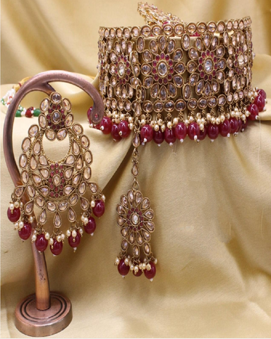 Charming Golden Color Necklace, Earrings and Matha Tikka with Beautiful Maroon Color Pearls on both Necklace and Earrings for Special Occasion