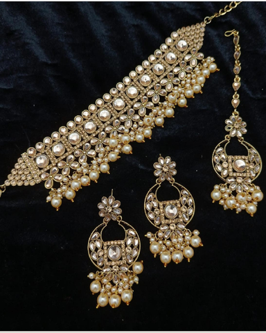 Beautiful Golden Color Necklace, Earrings and Matha Tikka with Lustrous Pearls for Special Occasion